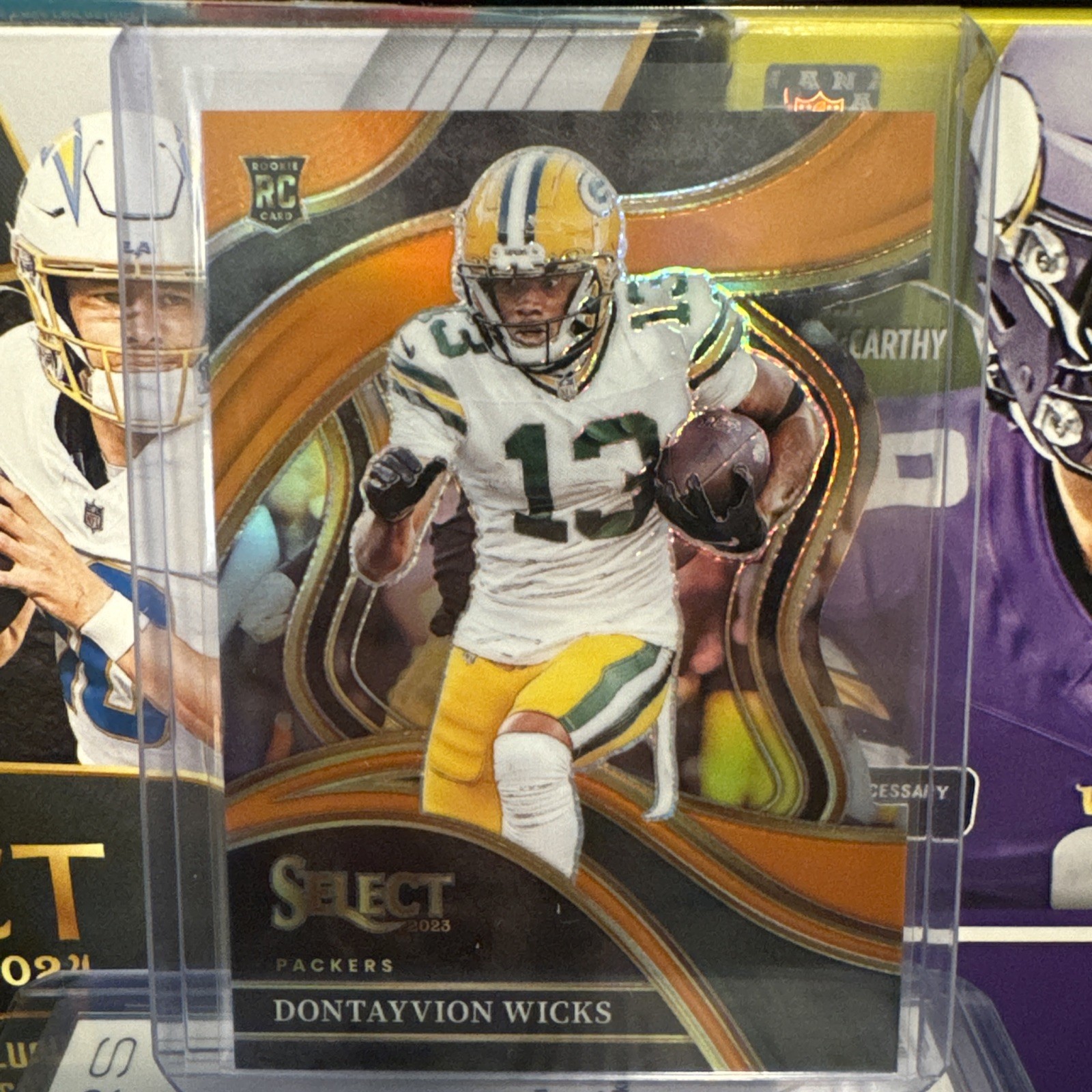 2023 Panini Select - Club Level Dontayvion Wicks Orange Prizm Die-Cut /399 (RC)