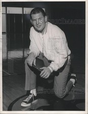 1968 Press Photo Bill Fitch, kneels on basketball court, new at Minnesota.