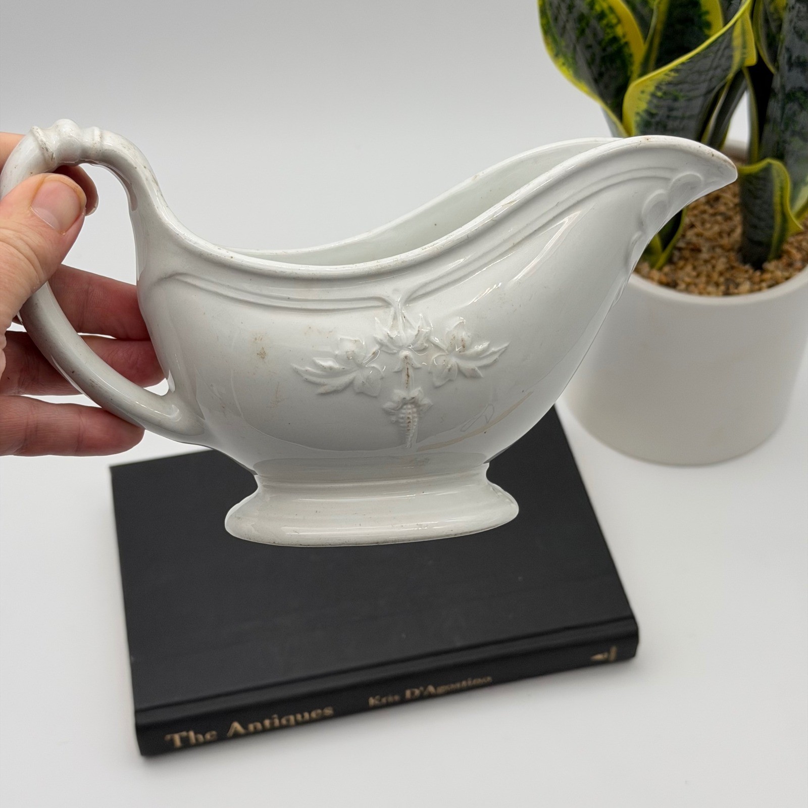 White Clementson Brothers ironstone gravy boat with embossed leaf design.