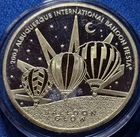 A 2003 ALBUQUERQUE BALLOON FIESTA BALLOON GLOW .999 SILVER COIN