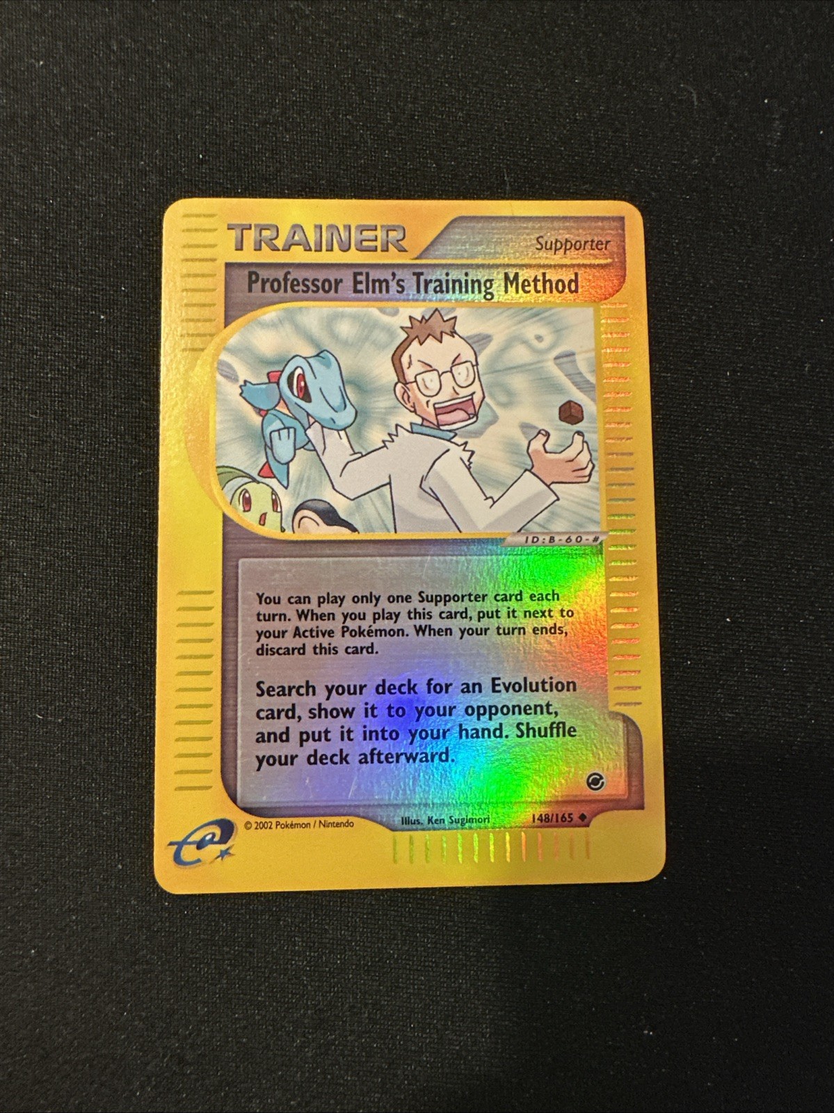 Pokémon Professor Elm's Training Method Reverse Holo 148/165 Expedition NM-Mint