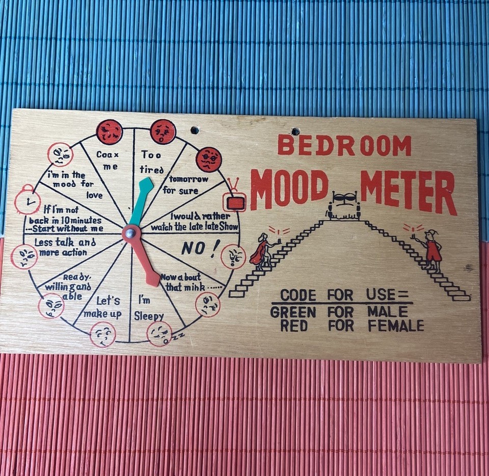 A vintage wooden 'Mood Meter' sign for the bedroom — retro novelty humor with genuine aged charm that beats any modern print.