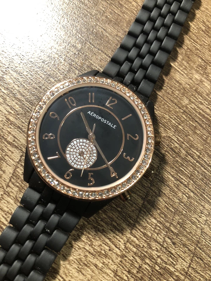 Reloj Mujer Aeropostale Tono Oro Rosa Bisel Gemado, Negro Batería Nueva Foto 2 de 4