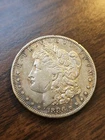 1886 S Morgan Dollar $1 Silver Higher Grade AU+ (Lamination On Cheek)