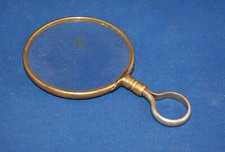 A large 19th century  loupe magnifying glass, brass frame,  loop handle