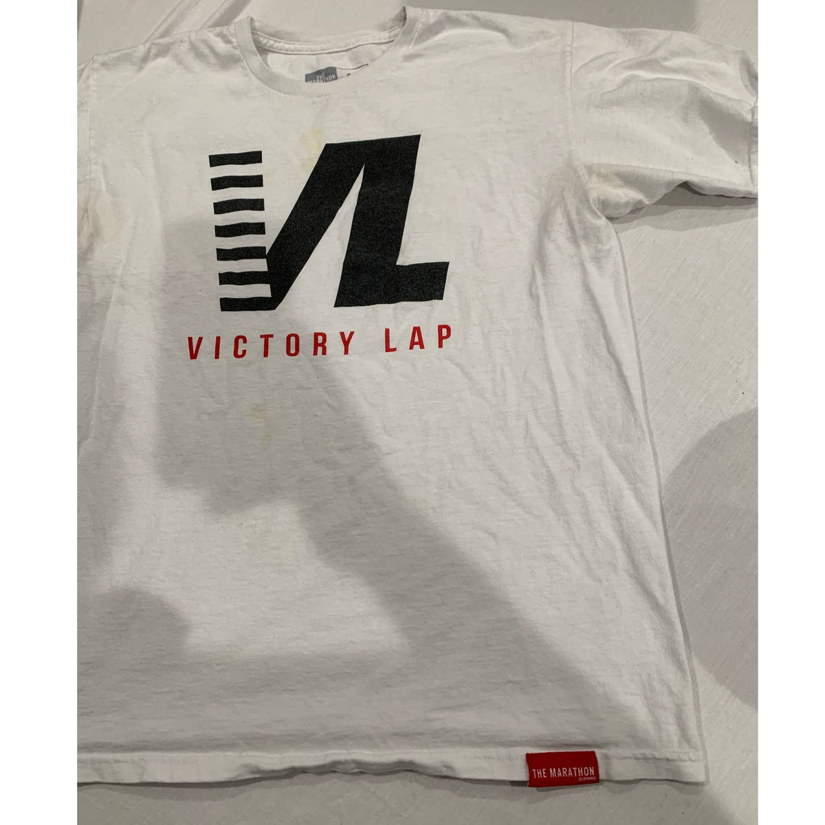 The Marathon Clothing TMC Victory Run a Lap White Graphic T-shirt
