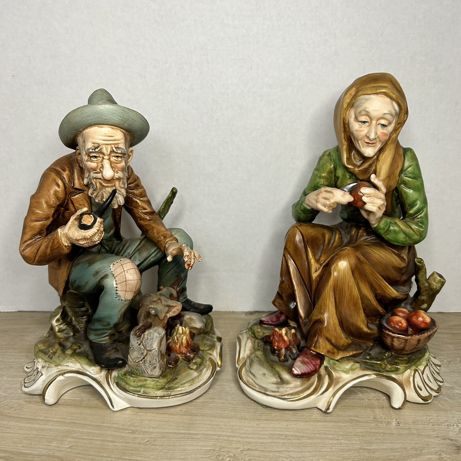 Vintage Ucagco Japan Ceramic Figurine Set - Man Smoking Pipe & Woman Peeling Apples