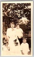 Vtg B&W Snapshot Mother Holding Baby Young Children White Dresses Tree Yard