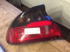 Opel Tigra (95) Original Rückleuchte Rücklicht links Valeo mit Lampenträger