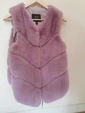 faux fur vest size M,new