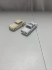 Two vintage matchbox cars, Lincoln town car and Rolls-Royce silver cloud