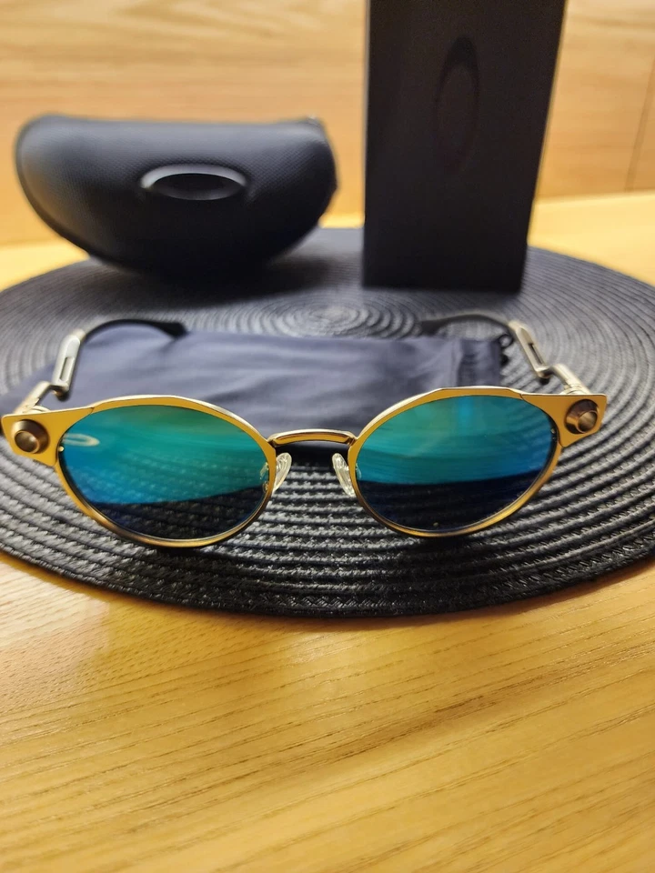 Lente polarizada Oakley Deadbolt marco de metal titanio azul Prizm totalmente nueva Foto 4 de 4