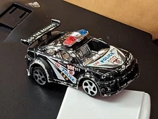 PHENOMENAL 911 POLICE SQUAD CAR C.O.P. SPECIAL EDITION W/ SPOILER 1:64 SCALE 