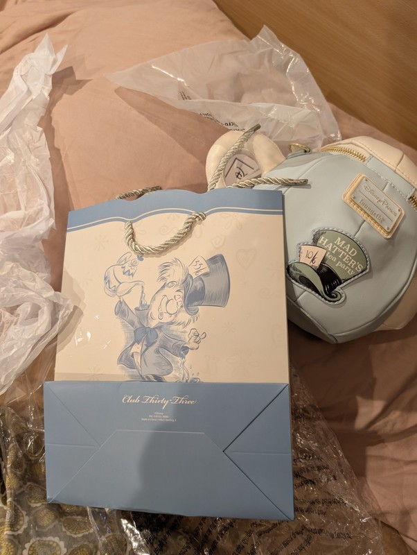 Club 33 Exclusive 75th Anniversary Alice In Wonderland Teapot Bag and a bag
