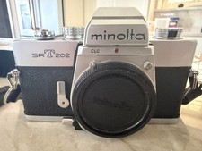 Minolta SRT202 35mm w/ two Milota lenses and one Albinar 75-300mm macro