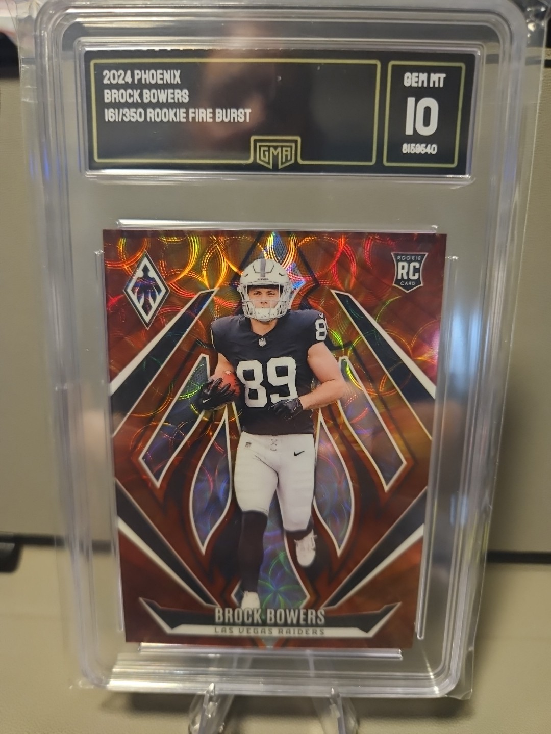 2024 Panini Phoenix - Rookies Brock Bowers #165 Fire Burst /350 (RC)