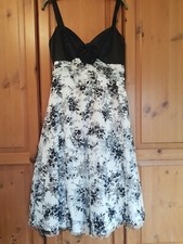 New Debut ballgown, cocktail dress. White with black flowers. Straps. Size 10