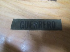 MILITARY PATCH OLDER COMBAT USED NAME TAPE SEW ON SUBDUED WITH NAME GUERRERO