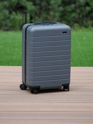 Away bigger carry-on in grey, with USB charger, laundry bag, built-in TSA lock