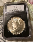 1923 MS-64 PEACE DOLLAR - NGC 25th ANNIVERSARY LABEL/BLACK SLAB