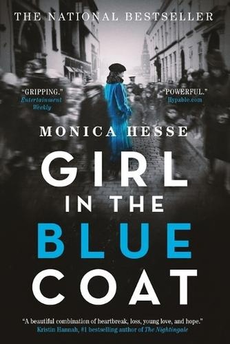 Woman in a blue coat and hat walking on a cobbled street, black-and-white street scene with buildings and people.