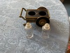Vintage MCM salt and pepper shakers in a heavy brass and metal cart — photo 2
