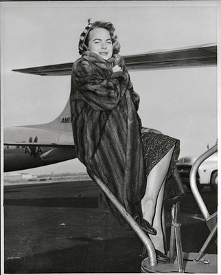Portrait of actress Terry Moore wearing a fur coat at an airport Old Photo