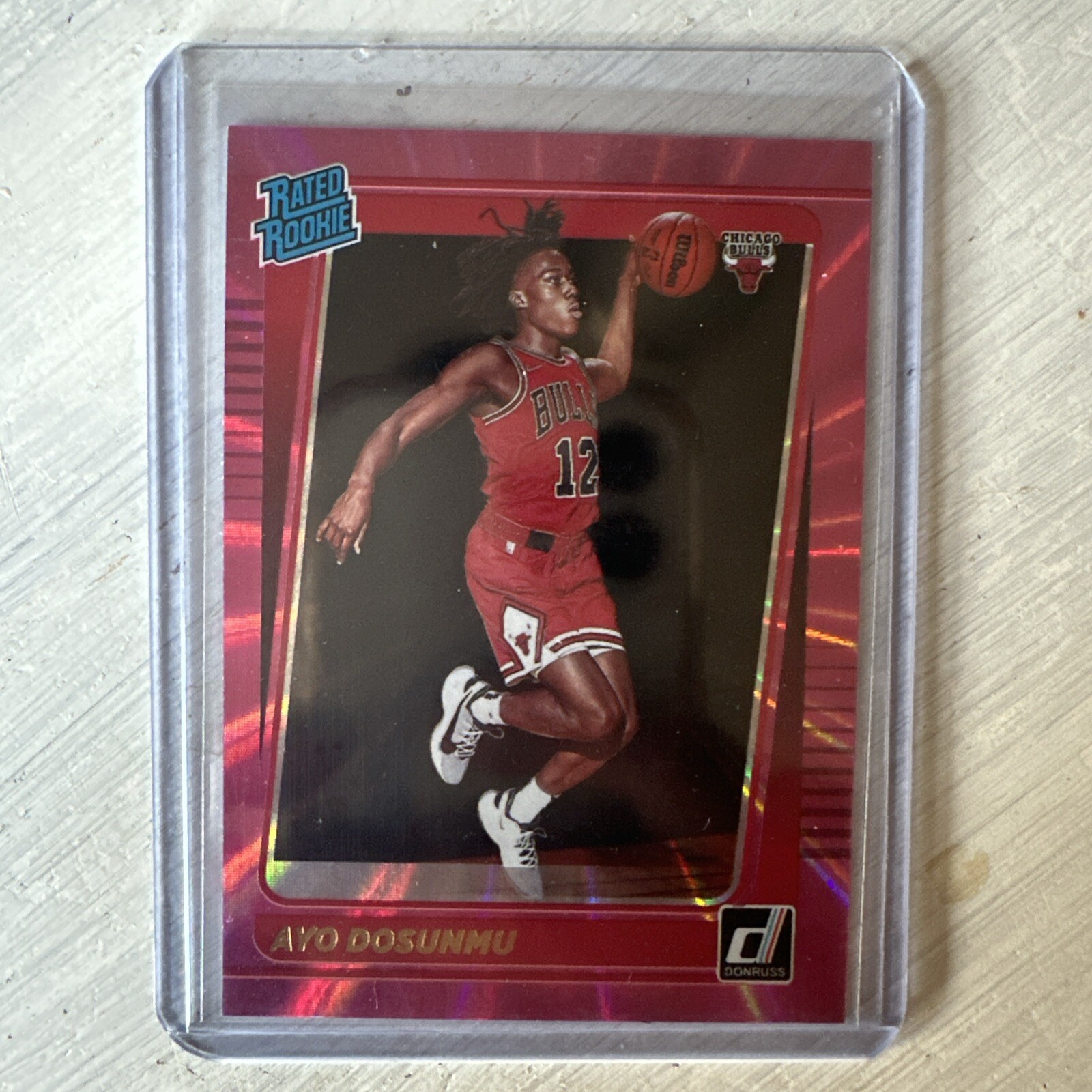 2021-22 Panini Donruss - Rated Rookie Holo Pink Laser #221 Ayo Dosunmu (RC)