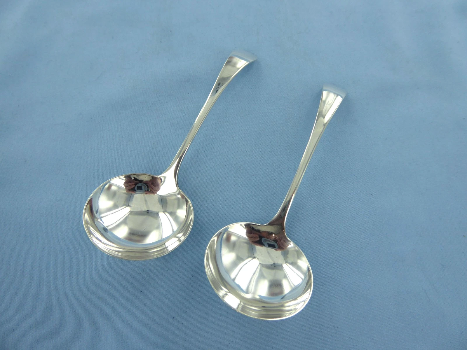 A VINTAGE PAIR OF STERLING SILVER, OLD ENGLISH SAUCE LADLES, BIRMINGHAM 1973.
Opens in a new window
