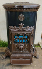 Poêle Godin 3726 ovale emmaillé marron sortie 125mm 4.64Kw buches 40cm