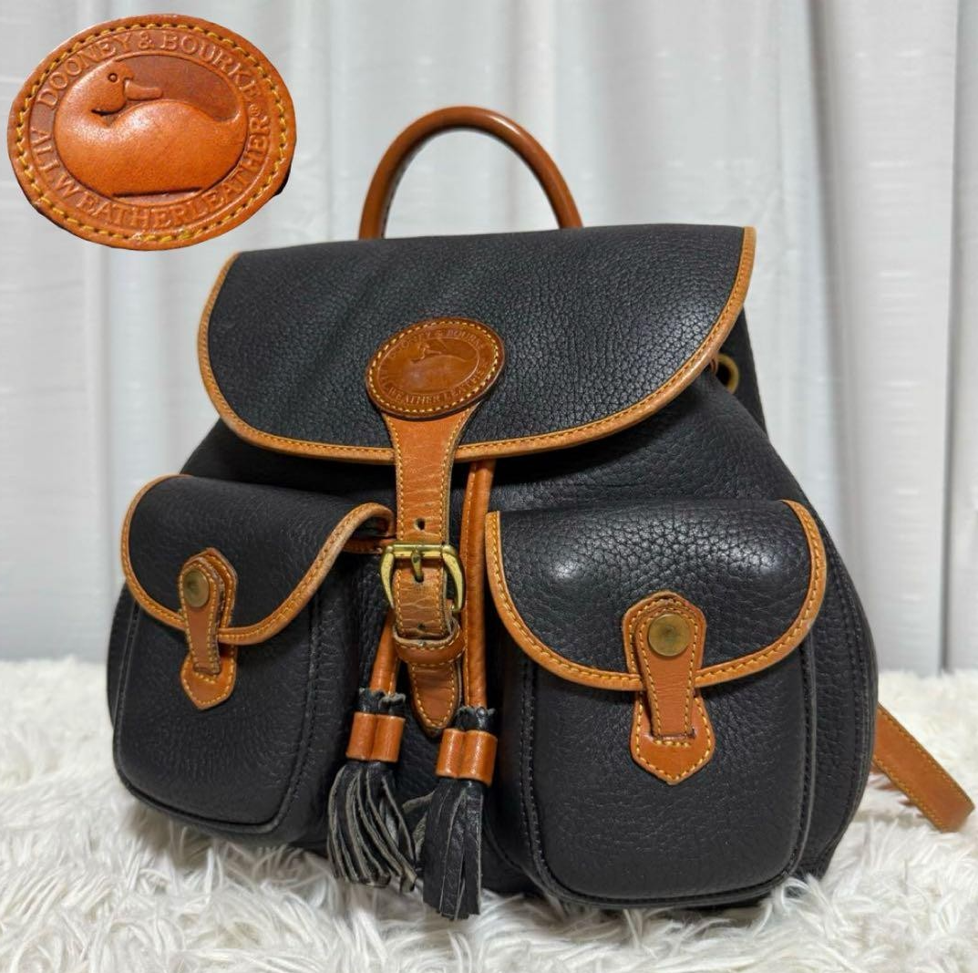 Vintage Dooney & Bourke genuine leather backpack with front pocket