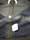 Black fitted men’s hat with white Air National Guard logo and small white tag on the side.