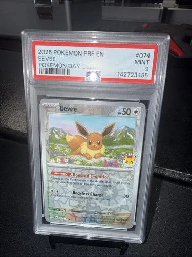 2025 POKEMON PRISMATIC EVOLUTION EEVEE #074/131 POKEMON DAY PROMO HOLO PSA 9