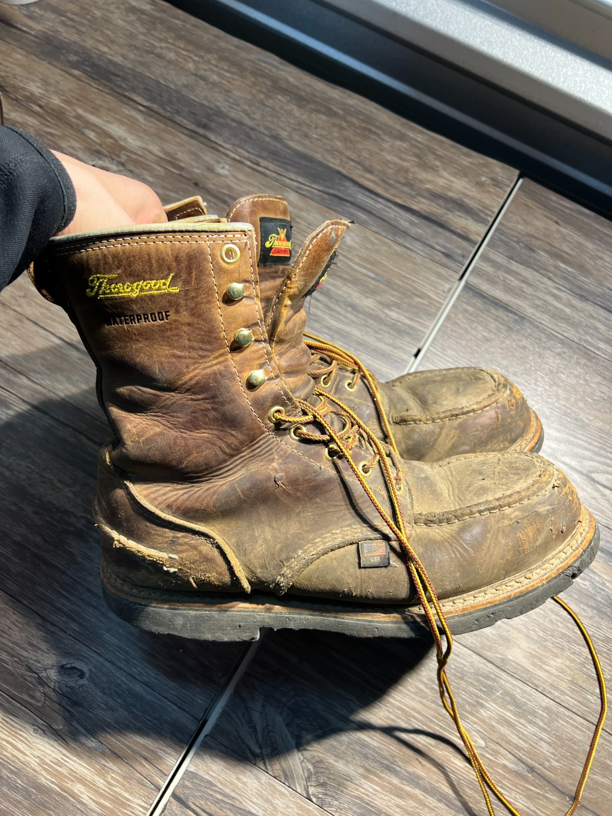 Thorogood 804-3898 men’s moc toe waterproof boots with brown leather, black laces, and gold logo on heel.