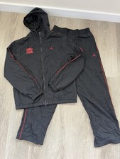 Jordan Brand Classic tracksuit black nylon jacket with red log  matching pants