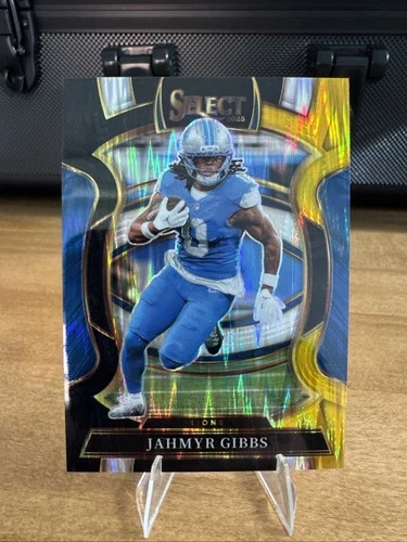 2025 Panini Select Jahmyr Gibbs Concourse Black and Gold Prizm Shock #71 Lions