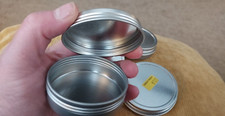 4 piece tin jars 2.5" round with lids clean and unused