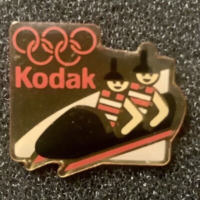 Pin’s Anneaux olympiques Kodak couleur argent