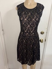 BCBG Maxazria Khloe sleeveless lace dress in black with a nude Lining A