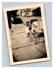 Vintage 1940's Photograph Toddler Pushing Baby Stroller on the Sidewalk - Funny