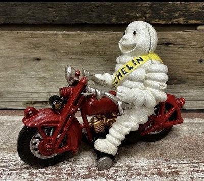 Michelin Man on Red Motorcycle Bibendum Cast Iron Toy, Wheels Move/Make Sounds
