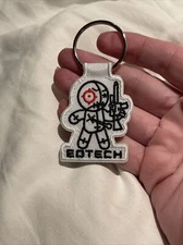 2022 SHOT SHOW EOTECH MAYHEM VUDU DOLL LOGO KEYCHAIN WHITE LAS VEGAS