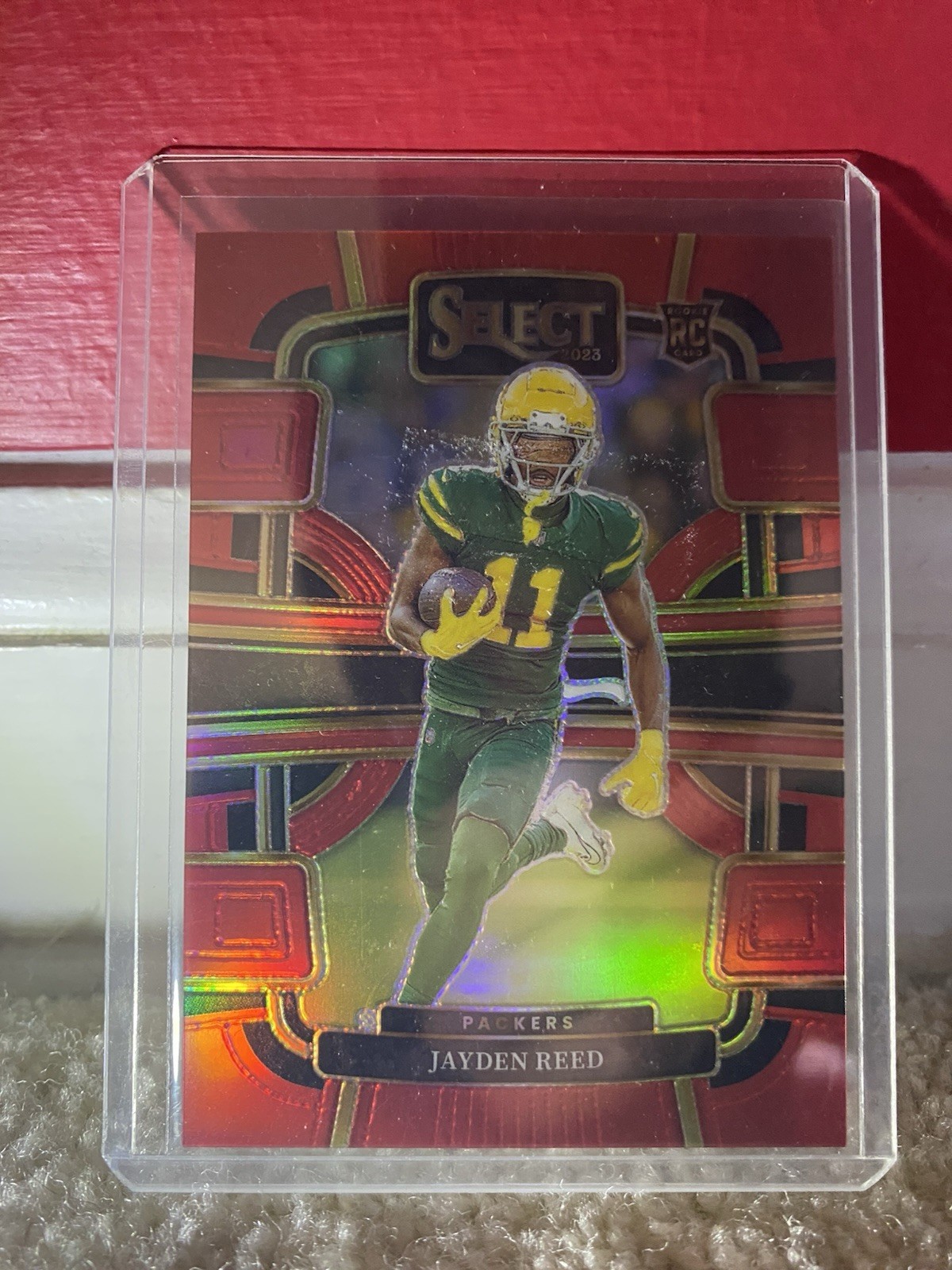 2023 Panini Select - Concourse Jayden Reed #38 Red Prizm /99 (RC) Packers