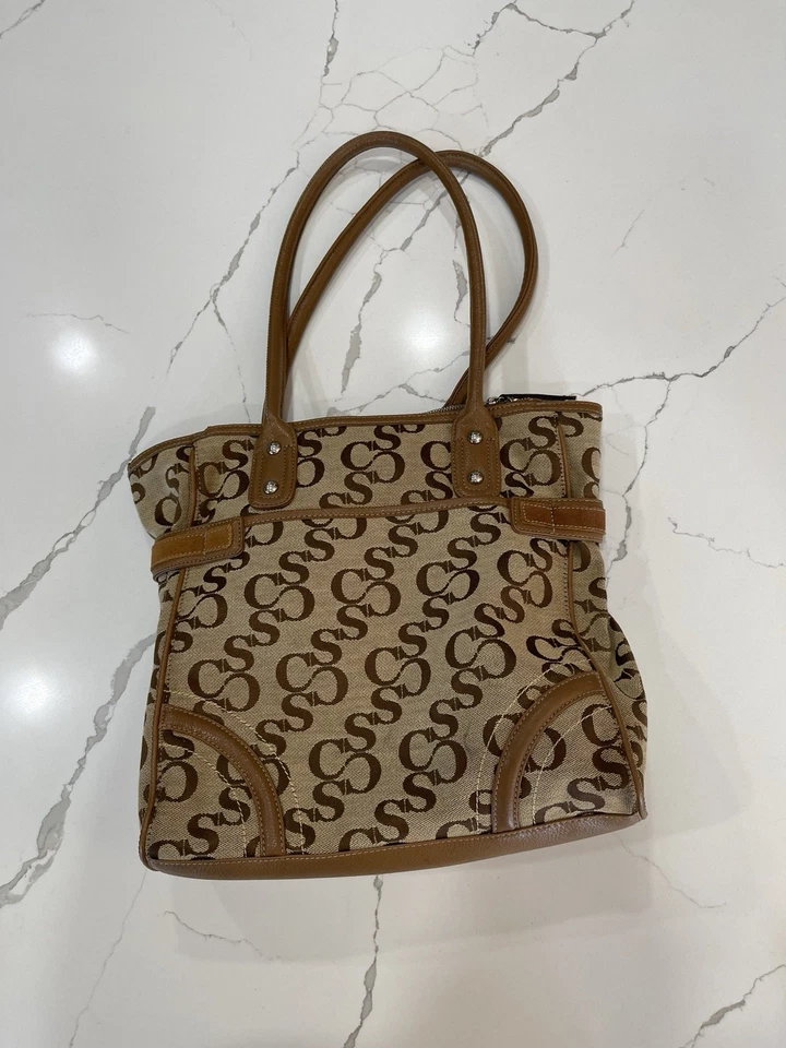 Bolso de Mano Sophia Caperelli Tostado Con Borde de Cuero Marrón Foto 2 de 4