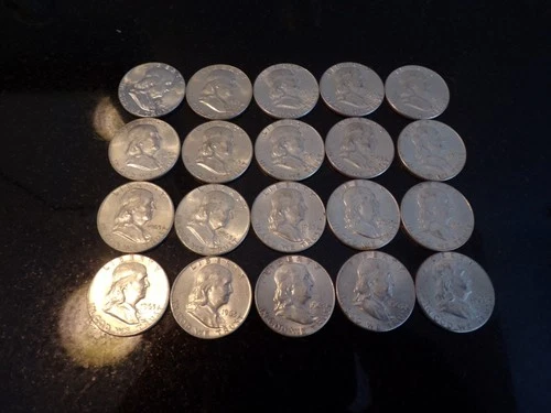 Roll of 20,au, bu, 1963 p,  Franklin Half Dollars. Slight toning on  some.