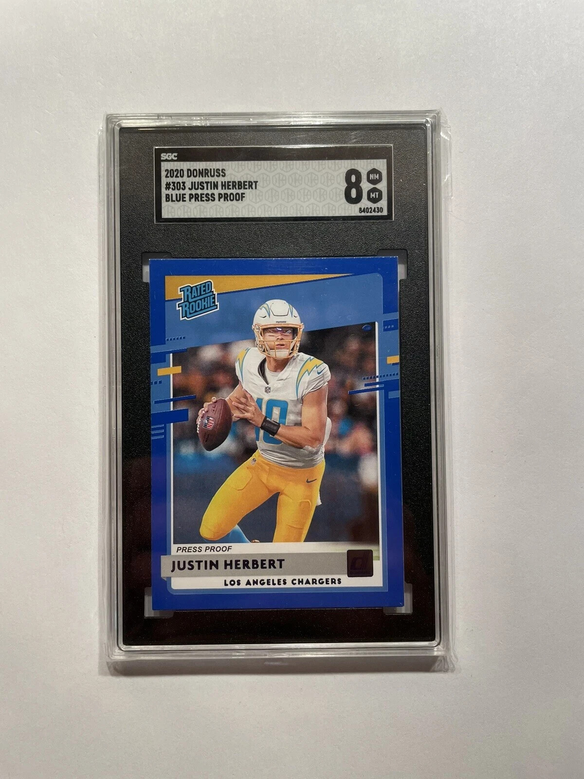 2020 Donruss - Rated Rookie Press Proof Blue #303 Justin Herbert (RC) - SGC 8