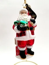 Christopher Radko - Tons Of Toys #1015286 Santa  Holding Green Car & Presents 