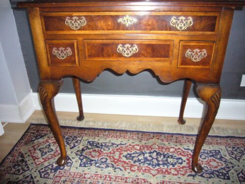 original queen anne table This is an elegant wooden table with a classic antique