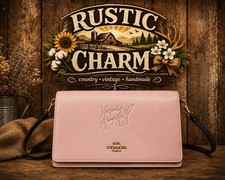 COACH Celena Gomez pink leather purse with embossed logo and gold hardware