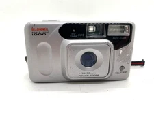 Bell + Howell Power Zoom 1000 Vintage 35 mm camera works well.